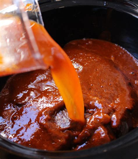 Chile Sauce Pouring Into The Slow Cooker Over The Beef Mexican Food