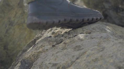 Close Up Of A Hiker S Feet In The Mountains A Boot On A Stone Man In