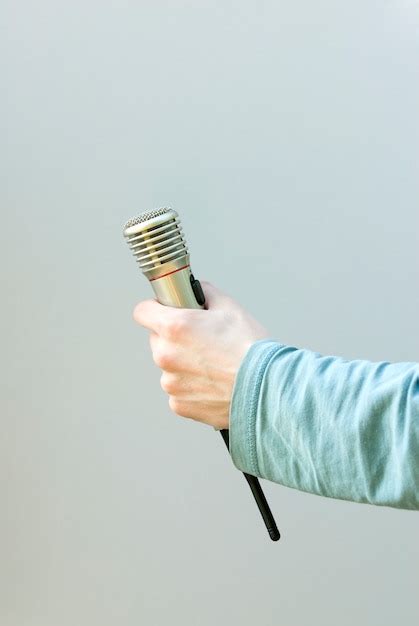 Free Photo Hand Holding Microphone