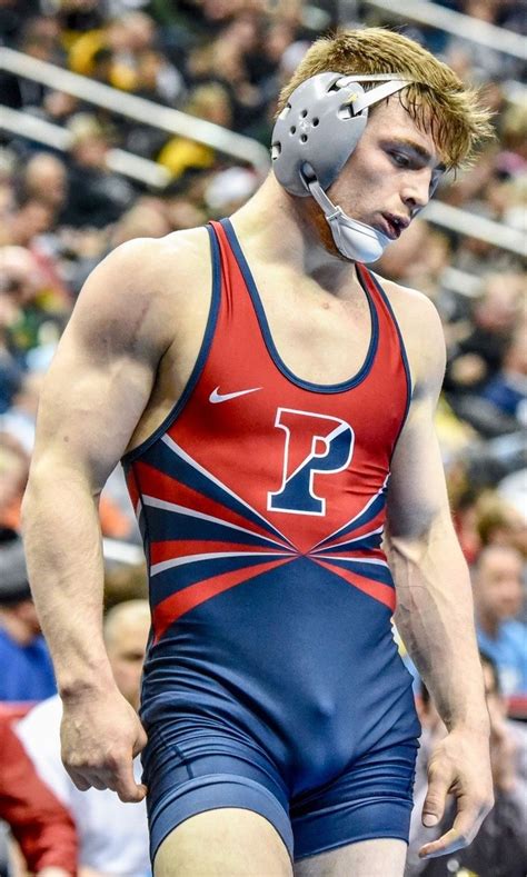 A Male Wrestler In A Red And Blue Wrestling Suit