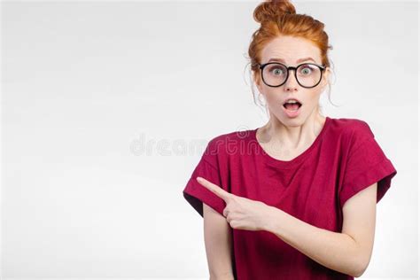 Surprised Girl Showing Empty Copy Space With Her Finger White