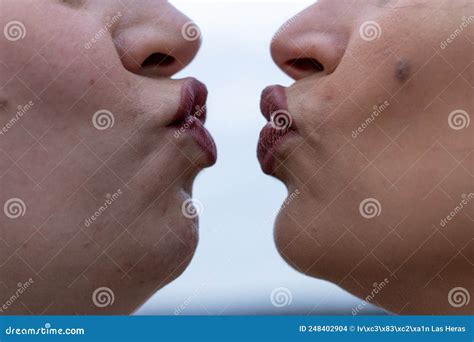 Close Up Of Two Women Puckering Lips About To Kiss Stock Photo Image Of Expression Lifestyle