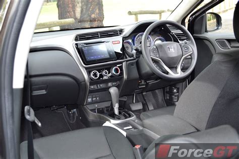 Photos with interiors and exterior of all new honda city 2014 sedan in india. Honda City Review: 2014 Honda City