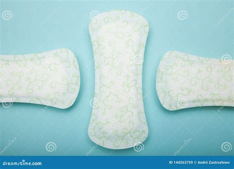Feminine White Hygienic Napkins On A Blue Background Top View Stock