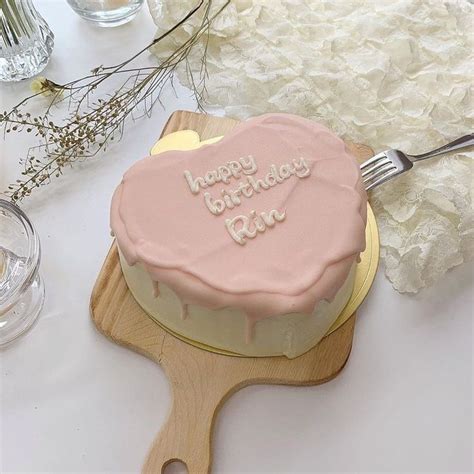 A Birthday Cake Sitting On Top Of A Wooden Spatula