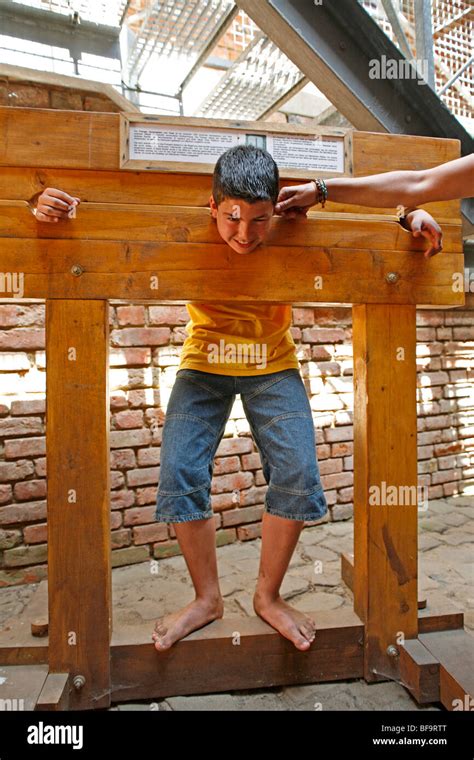 Teenage Boy In A Pillory Stock Photo Alamy