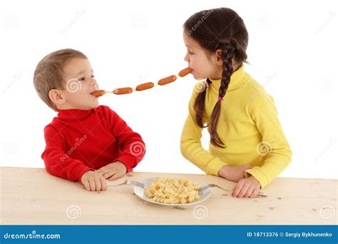 Little Children Sharing The Chain Of Sausages Stock Photo Image Of