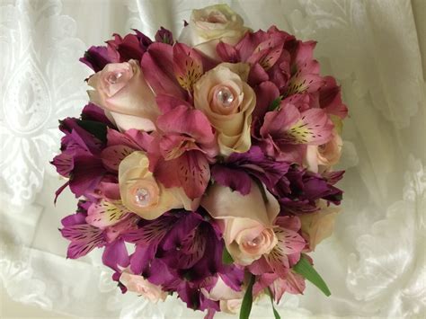 Pinks And Purplesin This Hand Held Prom Bouquet By Merritts Flowers