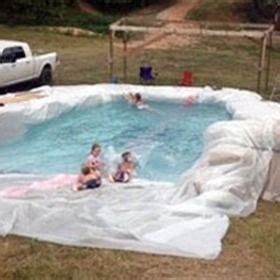 Swimming Pool Made Out Of A Tarp And Hay Bales Diy Swimming Pool