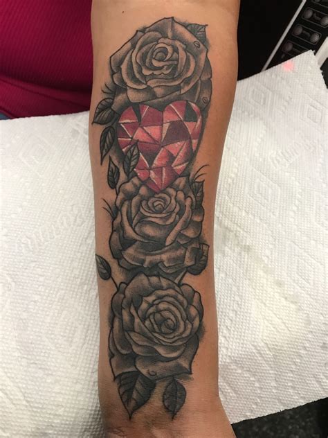 Similarly, floral tattoos can carry a very personal and meaningful message, or can simply exist because you enjoy their beauty. Black and Grey Rose with a Red Ruby Heart women forearm tattoo | Forearm tattoo women, Forearm ...