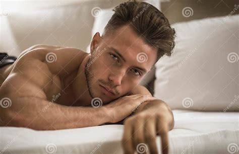 Shirtless Male Model Lying Alone On His Bed Stock Image Image Of Male Pillow 131106947