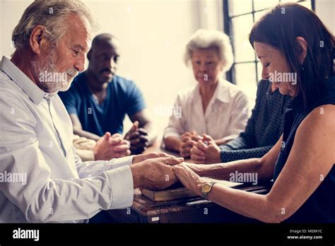 Group Of People Holding Hands Praying Worship Believe Stock Photo Alamy