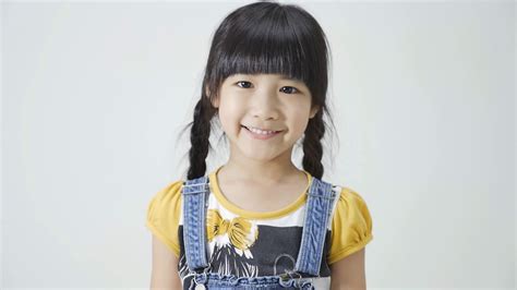 Little Asian Girl Is Smiling On White Background Stock Video Footage Storyblocks