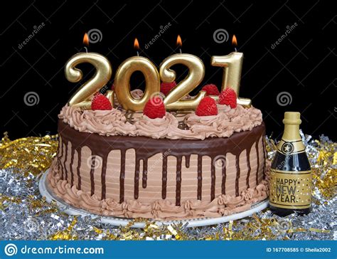 Of course, tastes differ, but for the great part of contemporary society it is really rather difficult even to imagine their day without a candy, a piece of chocolate, an ice cream or a cake? Happy New Year 2021 Cake With Candles Stock Image - Image ...