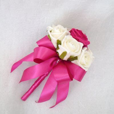 Find the perfect wedding bouquet and ribbons isolated stock photo. Wedding flowers - flowergirls posy bouquet ivory roses ...