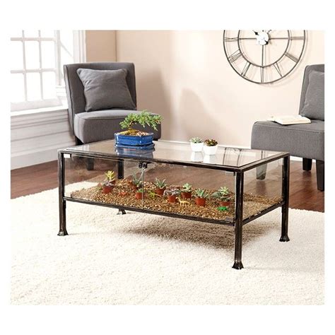 It is a beautiful and practical table with a liftable top plate. Metal & Glass Terrarium Display Cocktail Table | Display coffee table, Coffee table, Living room ...