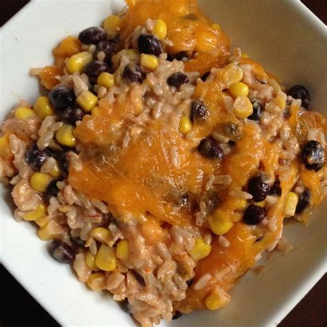 Serve immediately topped with chopped cilantro, green onions, avocado, tomato and sour cream or plain greek yogurt. Black Beans, Corn, and Rice Casserole - Shannon Mangerchine