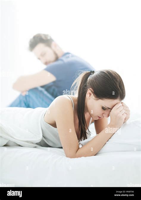 Young Couple In The Bedroom Having Relationship Difficulties And Arguing The Woman Is Crying