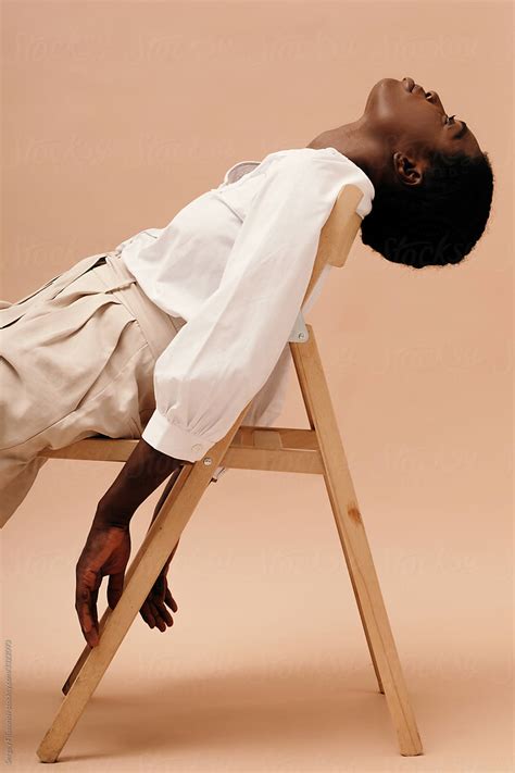 Portrait Stylish Black Woman Relax On Chair By Stocksy Contributor Sergey Filimonov Stocksy