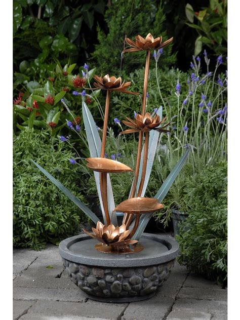 Planters can be suspended from your ceiling, railing and anywhere else to add some color. Metal Flower Outdoor Water Fountain | Садовые украшения ...