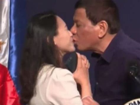 rodrigo duterte slammed for kissing woman on lips at public event daily telegraph