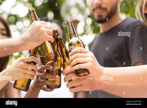 Group Of Friends Toasting Beers Outdoors Party People Drinks Toast