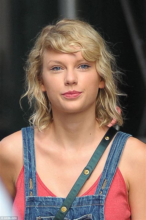 Taylor Swift Sports Kooky Bedhead Curls As She Steps Out In Leggy Denim Overalls In NYC Daily
