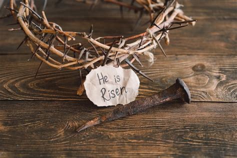 Premium Photo He Is Risen Jesus Crown Thorns And Nails And Cross On A