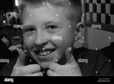 Portrait Of Boy Giving Thumbs Up Black And White Stock Photos And Images