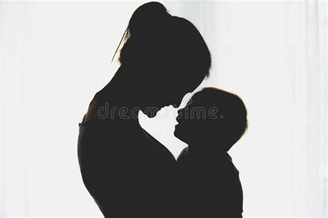 Young Mother Embracing With Tenderness And Care Her Baby Boy S Stock