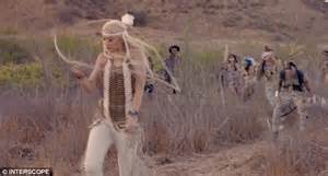 Gwen Stefani Dresses As A Native American Cavorts With A Wolf And