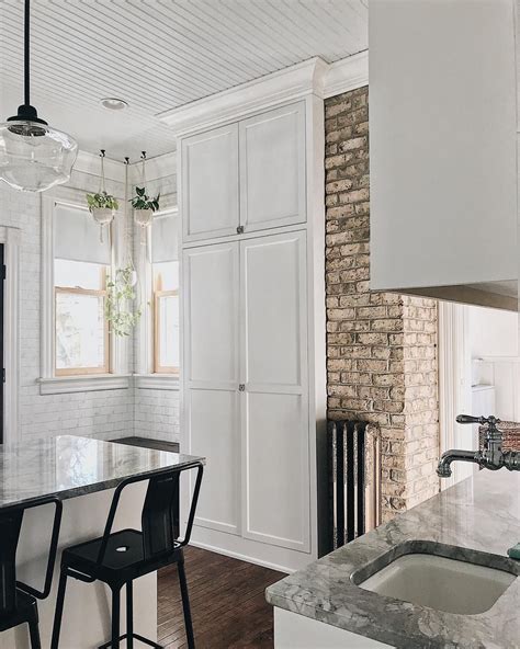 Check spelling or type a new query. Ceiling height kitchen cabinet next to exposed brick ...