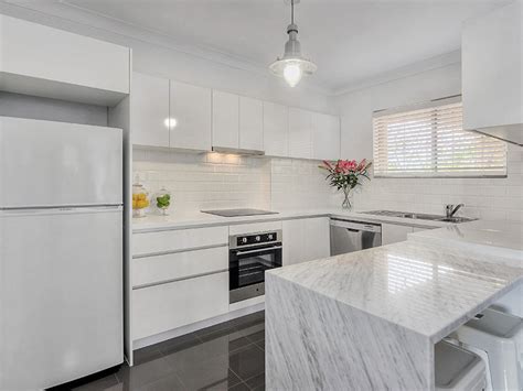Light maple floors and rustic wood beams offer natural texture that contrasts with a sleek subway tile backsplash and deeply swirled marble countertops. Gorgeous Home Colour Schemes with Grey | Tile Wizards ...
