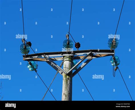Overhead Electric Power Transmission Lines With Blue Glass Insulators