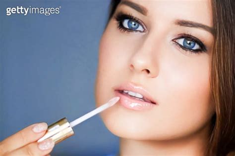 Beauty Makeup And Skincare Cosmetics Model Face Portrait Beautiful Woman Applying Lip Gloss