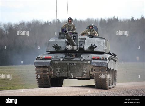A Challenger 2 Tank Travels At Speed On Salisbury Plain Training Area