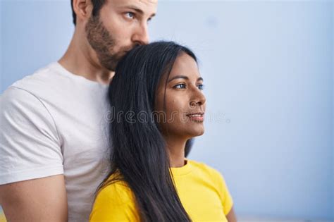 man and woman interracial couple hugging each other and kissing at home stock image image of