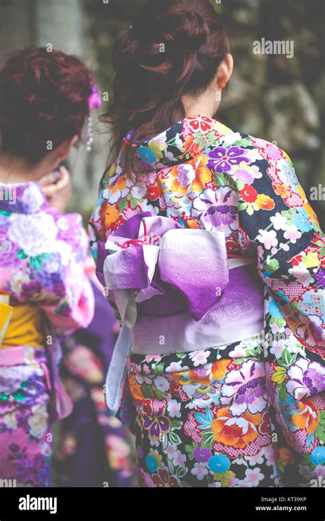 Japanese Women Wear A Traditional Dress Called Kimono For Sakura Viewing At Kiyomizu Temple In