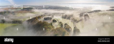 Aerial View By Drone Of Mist Over Restormel Castle In Cornwall England