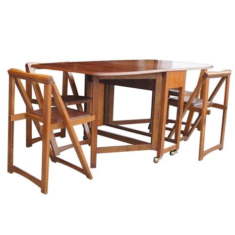 Maybe you would like to learn more about one of these? Vintage 68" Wood Folding Dining Table with Four Chairs Set ...