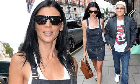Liberty Ross Displays Toned Legs As She Steps Out In Playful Denim Dungarees For Shopping Spree