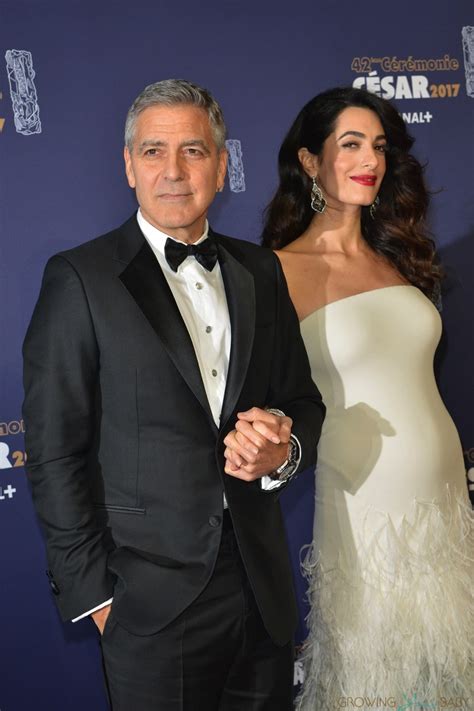 George Clooney And A Pregnant Amal Clooney Attend The Photocall For