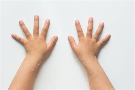 Premium Photo Two Hands Of Child With Widespread Fingers On The White