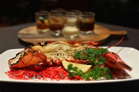 Baked Canadian Lobster With Cheese On Plate In Hotel Restaurant Stock