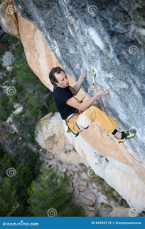 Extreme Sport Young Athletic Male Rock Climber Climbing Cliff Wall