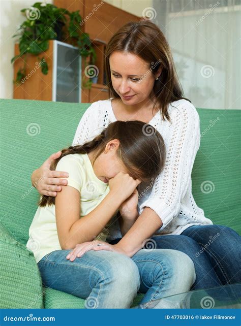 Woman Comforting Crying Daughter Stock Photo Image Of Home