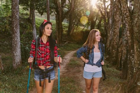 Free Photo Two Young Female Friends Hiking In Forest