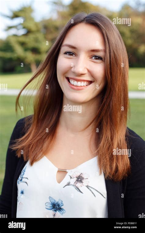 Closeup Portrait Of Beautiful Smiling Young European Caucasian Woman With Red Hair And Brown