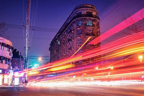 City Time Lapse Photography Of Cars Passing Through The Road Between