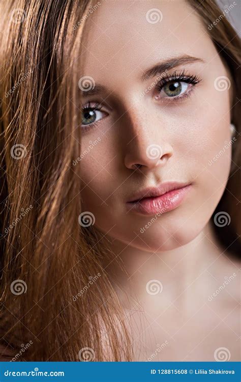 Closeup Face Of A Beautiful Redhead Young Woman With Freckles Charming